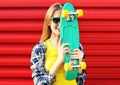 Portrait of fashion pretty cool girl with skateboard having fun Royalty Free Stock Photo