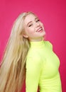 Portrait of fashion smiling blonde model girl young woman wearing stylish isolated on a pink