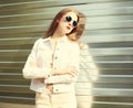 Portrait fashion young woman in sunglasses and white denim Royalty Free Stock Photo
