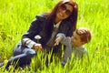 Portrait of fashionable baby boy and his gorgeous mother Royalty Free Stock Photo