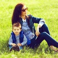 Portrait of fashionable baby boy and his stylish mother in trend Royalty Free Stock Photo