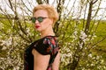 Portrait of fashionable blonde woman posing outside Royalty Free Stock Photo