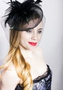 Portrait of a fashionable Elegant beautiful girl with red lips and a veil Royalty Free Stock Photo