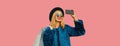 Portrait of fashionable happy smiling blonde woman taking selfie with mobile phone holds shopping bags wearing blue fur coat, Royalty Free Stock Photo