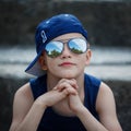 Portrait of Fashionable little boy in sunglasses and cap. Childhood Royalty Free Stock Photo