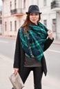 Portrait of fashionable woman in a cloak and a scarf. Royalty Free Stock Photo