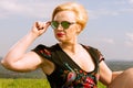 Portrait of fashionable woman wearing shades looking far away Royalty Free Stock Photo