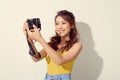 Portrait of fashionable young photographer with  digitalcamera Royalty Free Stock Photo