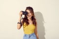 Portrait of fashionable young photographer with  digitalcamera Royalty Free Stock Photo