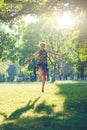 Portrait of fashionable young sensual blonde woman in garden enyoing on the grass field