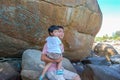 Portrait of a father carrying his son sitting on a rock , Koh Li Royalty Free Stock Photo