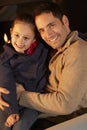 Portrait father and daughter by firelight Royalty Free Stock Photo