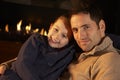 Portrait father and daughter by firelight Royalty Free Stock Photo