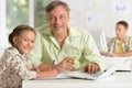 Portrait of father helping his daughter doing homework Royalty Free Stock Photo