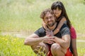 Portrait of a father and his daughter on a beautiful green meadow Royalty Free Stock Photo
