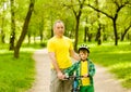 Portrait of father and son with a bicycle