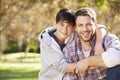 Portrait Of Father And Son In Countryside