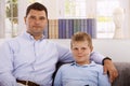 Portrait of father and son at home