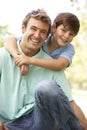 Portrait Of Father And Son In Park Royalty Free Stock Photo