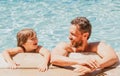 Portrait of father and son relax in swimming pool. Pool resort. Happy family face. Copy space. Royalty Free Stock Photo