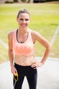 Portrait of female athlete standing with hands on hips Royalty Free Stock Photo