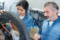 portrait female bike repairing apprentice