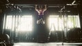 Portrait of a Female Bodybuilder Challenging Gender Stereotypes And Lifting Herself on a Pullup Bar