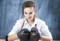 Female Boxer Posing in Brown Leather Boxer Gloves Royalty Free Stock Photo