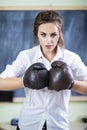 Portrait of Female Boxer Posing in Brown Leather Boxer Gloves Royalty Free Stock Photo