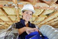 Portrait female builder holding materials