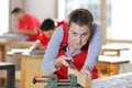 portrait female carpenter chiselling wood Royalty Free Stock Photo