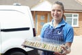 Female Caterer Delivering Tray Of Sandwiches To House Royalty Free Stock Photo