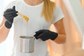 Portrait of a female caucasian beautician holding a jar of sugar paste for sugaring