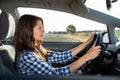 Portrait of female caucasian driver in car