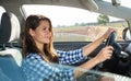 Portrait of female caucasian driver in car