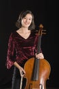 Portrait Of Female Cellist Standing With Cello