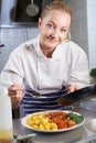 Portrait Of Female Chef Working In Restaurant Kitchen Royalty Free Stock Photo