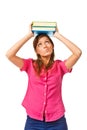Portrait of female college student carrying a pile of books over Royalty Free Stock Photo