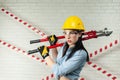 Portrait of a female construction worker in a hard hat with a bolt cutter in her hands Royalty Free Stock Photo
