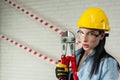 Portrait of a female construction worker in a hard hat with a bolt cutter in her hands Royalty Free Stock Photo