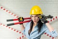 Portrait of a female construction worker in a hard hat with a bolt cutter in her hands Royalty Free Stock Photo