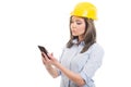 Portrait of female constructor browsing on smartphone
