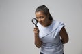 Portrait Of Female Criminologist With Magnifying Glass Royalty Free Stock Photo