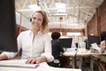 Portrait Of Female Customer Services Agent Working At Desk In Call Center Royalty Free Stock Photo