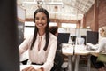 Portrait Of Female Customer Services Agent Working At Desk In Call Center Royalty Free Stock Photo