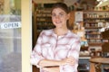 Portrait Of Female Delicatessen Owner Outside Store