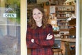 Portrait Of Female Delicatessen Owner Outside Store