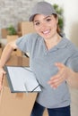 portrait female delivery driver with clipboard Royalty Free Stock Photo