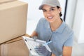 portrait female delivery driver with clipboard Royalty Free Stock Photo