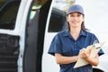 Portrait Of Female Delivery Driver With Clipboard